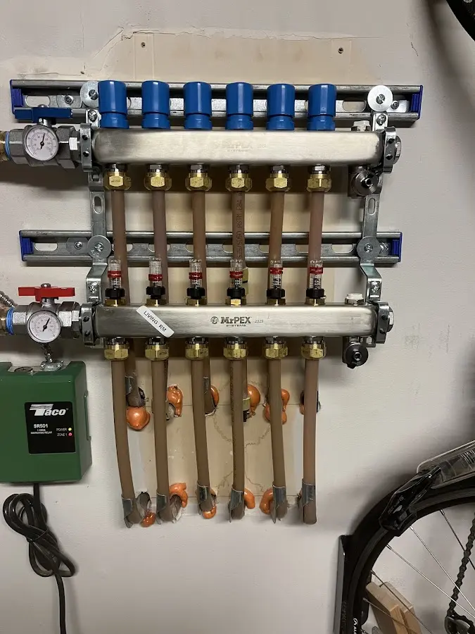 Plumber performing Water Heater Repair at a residential property in Smithville